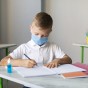 kids-writing-classroom-while-wearing-medical-masks.jpg
