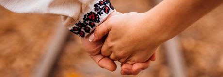 closeup-couple-s-hands-held-together-rails.jpg