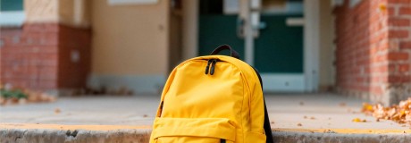 yellow-backpack-school-steps-with-fallen-leaves.jpg