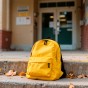 yellow-backpack-school-steps-with-fallen-leaves.jpg